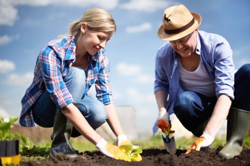 Gardener inspecting a safe working area before starting outdoor maintenance